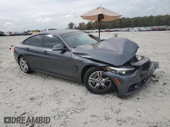 2018 BMW 4 Series 440i with VIN WBA4J5C51JBF07689, listed as a Copart auction lot 79044244 with 138,562 mi miles and Salvage Title. Bid and sale history available at DreamBid. Image 4.
