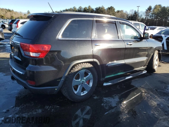 2013 Jeep Grand Cherokee Overland with VIN 1C4RJFCTXDC525097, listed as a Copart auction lot 42250875 with 214,368 mi miles and Salvage Title. Bid and sale history available at carsss.com. Image 3.