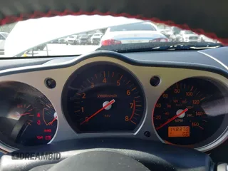 2004 Nissan 350Z Touring with VIN JN1AZ34E74T064156, listed as a IAAI auction lot 41498213 with 148,370 mi miles. Bid and sale history available at carsss.com. Image 7.