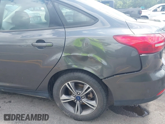 2018 Ford Focus SE with VIN 1FADP3FE2JL263954, listed as a IAAI auction lot 42480748 with 111,059 mi miles and . Bid and sale history available at DreamBid. Image 6.