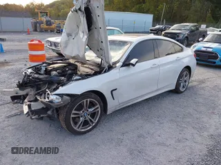 2015 BMW 4 Series 428i xDrive z VIN WBA4C9C57FD330866, wystawiony jako IAAI lot #40574326 z przebiegiem 123 726 mil mil oraz . Historia ofert i sprzedaży dostępna na DreamBid. Obrazek 18.