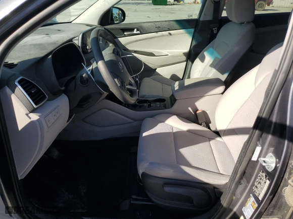 2019 Hyundai Tucson SE with VIN KM8J23A41KU945578, listed as a Copart auction lot 77248584 with 69,359 mi miles and Salvage Title. Bid and sale history available at carsss.com. Image 7.