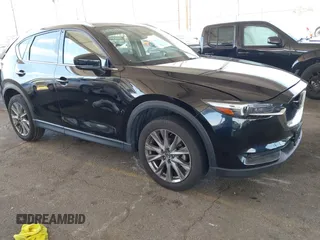 2021 Mazda CX-5 Grand Touring with VIN JM3KFADMXM1342413, listed as a IAAI auction lot 41867153 with 38,519 mi miles. Bid and sale history available at carsss.com. Image 1.