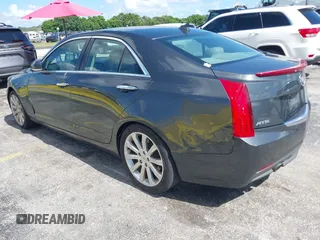 2014 Cadillac ATS Luxury RWD z VIN 1G6AB5RAXE0142079, wystawiony jako IAAI lot #42517963 z przebiegiem 140 118 mil mil oraz . Historia ofert i sprzedaży dostępna na DreamBid. Obrazek 3.
