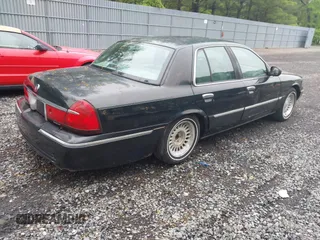2002 Mercury Grand Marquis LS Premium z VIN 2MEFM75W42X644236, wystawiony jako IAAI lot #42276863 z przebiegiem 56 460 mil mil oraz . Historia ofert i sprzedaży dostępna na DreamBid. Obrazek 4.