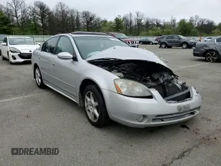 2003 Nissan Altima SE z VIN 1N4BL11EX3C227429, wystawiony jako Copart lot #56659075 z przebiegiem Nie podano mil oraz Szkoda całkowita • Salvage title. Historia ofert i sprzedaży dostępna na DreamBid. Obrazek 13.