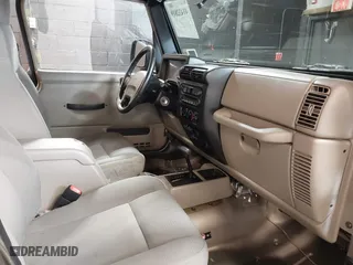 2004 Jeep Wrangler Sahara with VIN 1J4FA59S64P736389, listed as a IAAI auction lot 41432819 with 102,830 mi miles. Bid and sale history available at carsss.com. Image 5.