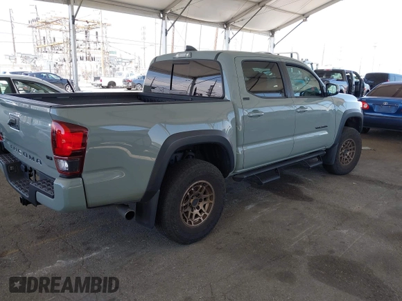 2022 Toyota Tacoma SR with VIN 3TMCZ5ANXNM479025, listed as a IAAI auction lot 42280363 with 29,650 mi miles and . Bid and sale history available at DreamBid. Image 4.