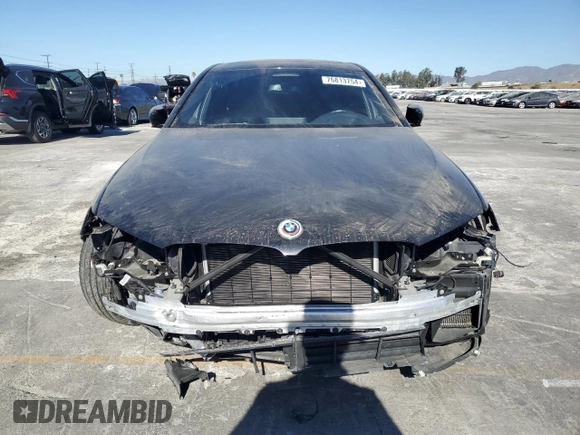2023 BMW 5 Series M550i xDrive с VIN WBA13BK04PCM97306, выставлен на аукционе Copart как лот 76813754 с пробегом 19 259 миль миль и Списание • Salvage title. История ставок и продаж доступна на DreamBid. Изображение 5.