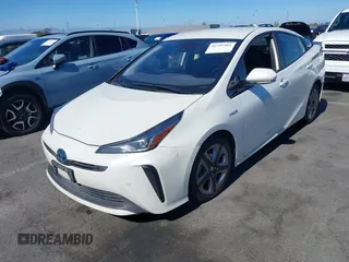 2020 Toyota Prius L Eco with VIN JTDKARFUXL3107211, listed as a IAAI auction lot 42797561 with 328,023 mi miles and . Bid and sale history available at DreamBid. Image 2.