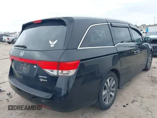 2014 Honda Odyssey Touring with VIN 5FNRL5H9XEB045695, listed as a IAAI auction lot 41545348 with 131,472 mi miles and . Bid and sale history available at carsss.com. Image 4.