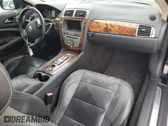 2010 Jaguar XK with VIN SAJWA4GBXALB36341, listed as a Copart auction lot 68307584 with 76,951 mi miles and Salvage Title. Bid and sale history available at carsss.com. Image 8.