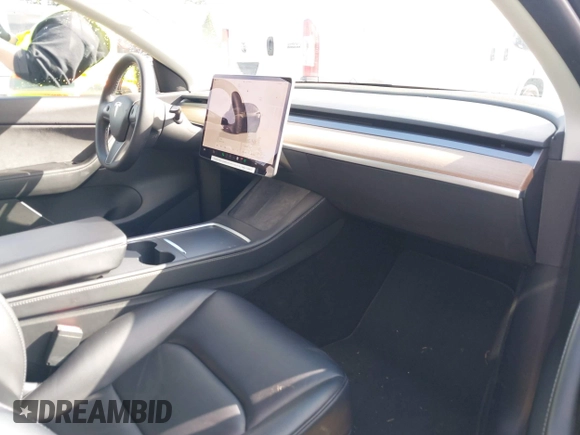 2022 Tesla Model Y Long Range with VIN 7SAYGDEEXNF459834, listed as a IAAI auction lot 42004576 with 56,175 mi miles and . Bid and sale history available at carsss.com. Image 5.