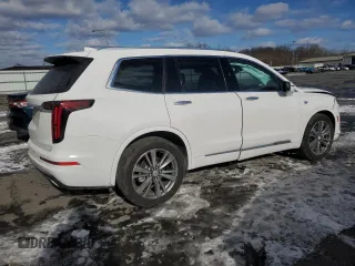 2022 Cadillac XT6 Premium Luxury with VIN 1GYKPCRS4NZ128684, listed as a Copart auction lot 87806525 with 23,571 mi miles and Salvage Title. Bid and sale history available at carsss.com. Image 3.