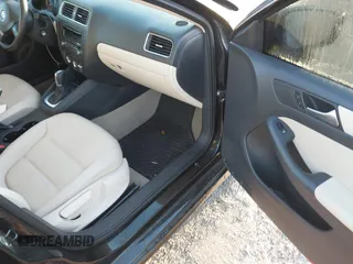 2012 Volkswagen Jetta SE z VIN 3VWDX7AJ0CM340552, wystawiony jako IAAI lot #41780133 z przebiegiem 126 988 mil mil oraz . Historia ofert i sprzedaży dostępna na DreamBid. Obrazek 5.