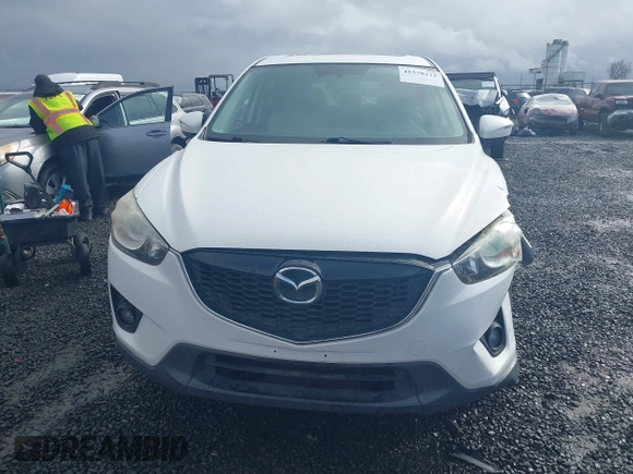 2015 Mazda CX-5 Grand Touring with VIN JM3KE4DY0F0483037, listed as a IAAI auction lot 41578222 with 102,988 mi miles. Bid and sale history available at carsss.com. Image 12.