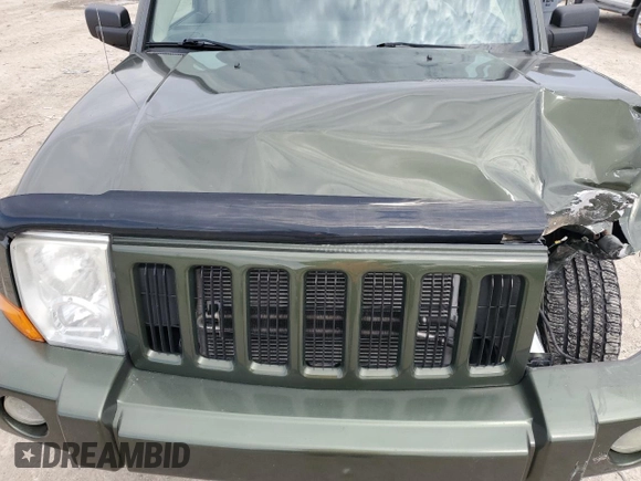 2006 Jeep Commander with VIN 1J8HG48K06C297654, listed as a Copart auction lot 51000155 with 126,235 mi miles and Salvage Title. Bid and sale history available at DreamBid. Image 14.