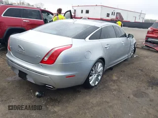 2015 Jaguar XJ with VIN SAJWA2GZ8F8V83551, listed as a IAAI auction lot 41909403 with 112,098 mi miles. Bid and sale history available at carsss.com. Image 4.