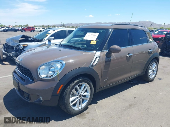 2013 MINI Countryman S ALL4 with VIN WMWZC5C54DWP34224, listed as a IAAI auction lot 42141400 with 33,307 mi miles and . Bid and sale history available at DreamBid. Image 2.