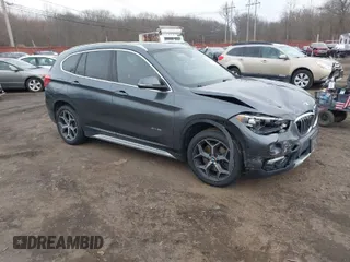 2017 BMW X1 xDrive28i with VIN WBXHT3C35H5F74213, listed as a IAAI auction lot 41589180 with 58,990 mi miles. Bid and sale history available at carsss.com. Image 1.