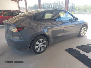 2023 Tesla Model Y Long Range with VIN 7SAYGAEE4PF906577, listed as a IAAI auction lot 42174987 with 13,260 mi miles and . Bid and sale history available at DreamBid. Image 4.