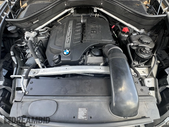 2013 BMW X5 xDrive35i z VIN 5UXZV4C56D0G52619, wystawiony jako IAAI lot #41990893 z przebiegiem 107 080 mil mil oraz . Historia ofert i sprzedaży dostępna na DreamBid. Obrazek 10.