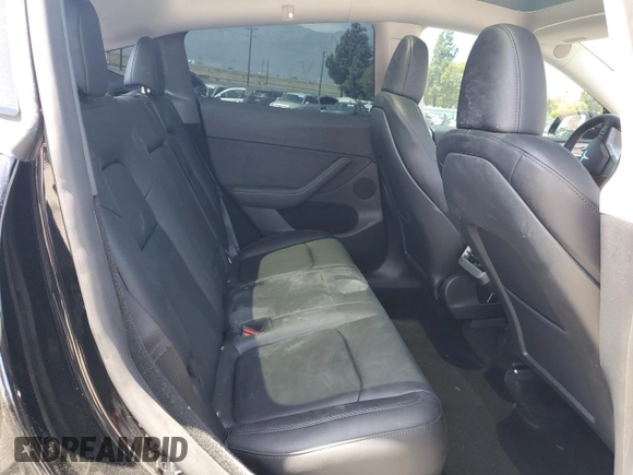 2024 Tesla Model Y Long Range with VIN 7SAYGDEE0RF123793, listed as a Copart auction lot 57177305 with 20,053 mi miles and Salvage title. Bid and sale history available at DreamBid. Image 11.