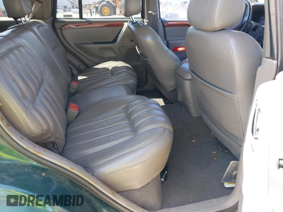 1999 Jeep Grand Cherokee Limited with VIN 1J4GW68N5XC666564, listed as a IAAI auction lot 42117018 with 177,440 mi miles. Bid and sale history available at carsss.com. Image 8.