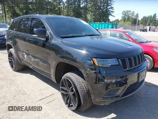 2021 Jeep Grand Cherokee Overland with VIN 1C4RJFCG3MC618885, listed as a IAAI auction lot 42158667 with 49,258 mi miles and . Bid and sale history available at DreamBid. Image 1.