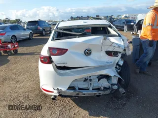 2020 Mazda 3 Premium with VIN 3MZBPAEM3LM132772, listed as a IAAI auction lot 42067269 with 53,751 mi miles and . Bid and sale history available at DreamBid. Image 16.