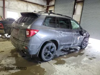 2021 Honda Passport Elite z VIN 5FNYF8H05MB021597, wystawiony jako Copart lot #44463515 z przebiegiem Nie podano mil oraz Szkoda całkowita • Salvage title. Historia ofert i sprzedaży dostępna na DreamBid. Obrazek 3.