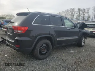 2013 Jeep Grand Cherokee Overland with VIN 1C4RJFCGXDC643802, listed as a Copart auction lot 52429535 with 122,014 mi miles and Salvage Title. Bid and sale history available at carsss.com. Image 3.