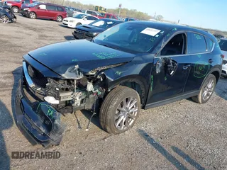 2019 Mazda CX-5 Grand Touring with VIN JM3KFBDM7K0525650, listed as a IAAI auction lot 42032757 with 65,530 mi miles and . Bid and sale history available at DreamBid. Image 2.