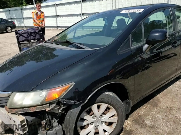 2012 Honda Civic LX z VIN 19XFB2F50CE051626, wystawiony jako Copart lot #59477235 z przebiegiem 126 225 mil mil oraz Szkoda całkowita • Salvage title. Historia ofert i sprzedaży dostępna na DreamBid. Obrazek 13.