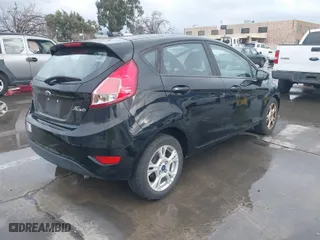 2016 Ford Fiesta SE with VIN 3FADP4EJ1GM143798, listed as a IAAI auction lot 41588665 with 97,938 mi miles. Bid and sale history available at carsss.com. Image 4.