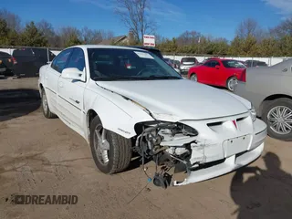 2001 Pontiac Grand Am GT with VIN 1G2NW52E11C244447, listed as a IAAI auction lot 41697883 with 81,983 mi miles. Bid and sale history available at carsss.com. Image 6.