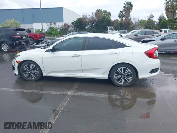 2017 Honda Civic EX-L z VIN 2HGFC1F79HH635156, wystawiony jako IAAI lot #41922115 z przebiegiem 142 565 mil mil oraz . Historia ofert i sprzedaży dostępna na DreamBid. Obrazek 14.