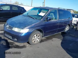 2004 Honda Odyssey EX z VIN 5FNRL18614B080980, wystawiony jako IAAI lot #41940014 z przebiegiem 233 465 mil mil oraz . Historia ofert i sprzedaży dostępna na DreamBid. Obrazek 2.