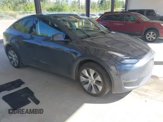 2023 Tesla Model Y Long Range with VIN 7SAYGAEE4PF906577, listed as a IAAI auction lot 42174987 with 13,260 mi miles and . Bid and sale history available at DreamBid. Image 1.