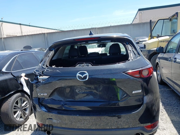 2018 Mazda CX-5 Grand Touring with VIN JM3KFADM4J0326760, listed as a IAAI auction lot 41885100 with 82,091 mi miles and . Bid and sale history available at DreamBid. Image 16.