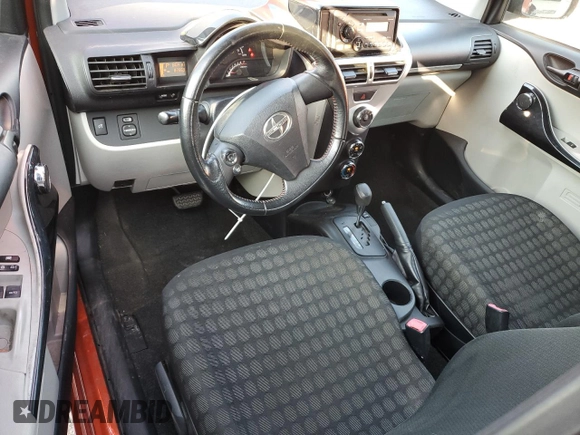2012 Scion iQ z VIN JTNJJXB0XCJ020404, wystawiony jako Copart lot #62157565 z przebiegiem 82 869 mil mil oraz Nie do naprawy • Non repairable. Historia ofert i sprzedaży dostępna na DreamBid. Obrazek 8.