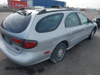1999 Ford Taurus SE z VIN 1FAFP58S4XA299009, wystawiony jako IAAI lot #41775412 z przebiegiem 80 634 mil mil oraz . Historia ofert i sprzedaży dostępna na DreamBid. Obrazek 4.