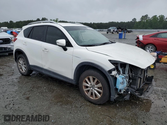 2016 Mazda CX-5 Touring z VIN JM3KE2CY5G0849288, wystawiony jako Copart lot #54594545 z przebiegiem 90 882 mil mil oraz Szkoda całkowita • Salvage title. Historia ofert i sprzedaży dostępna na DreamBid. Obrazek 4.