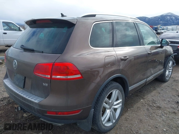2013 Volkswagen Touareg Lux with VIN WVGEF9BP1DD012851, listed as a IAAI auction lot 41732391 with 123,283 mi miles and . Bid and sale history available at DreamBid. Image 4.