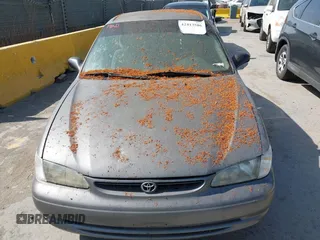 1999 Toyota Corolla VE z VIN 1NXBR12E5XZ237045, wystawiony jako IAAI lot #42413586 z przebiegiem Nie podano mil oraz . Historia ofert i sprzedaży dostępna na DreamBid. Obrazek 6.