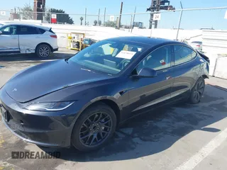 2024 Tesla Model 3 with VIN 5YJ3E1EA7RF717855, listed as a IAAI auction lot 41838814 with 8,750 mi miles and . Bid and sale history available at DreamBid. Image 2.