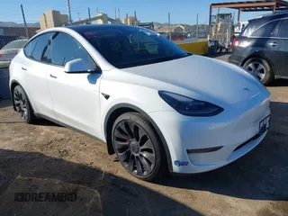 2021 Tesla Model Y Performance with VIN 5YJYGDEFXMF277832, listed as a IAAI auction lot 41372497 with 28,083 mi miles. Bid and sale history available at carsss.com. Image 1.