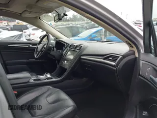 2017 Ford Fusion Hybrid Titanium z VIN 3FA6P0RU7HR300311, wystawiony jako IAAI lot #42045664 z przebiegiem 136 231 mil mil oraz . Historia ofert i sprzedaży dostępna na DreamBid. Obrazek 5.