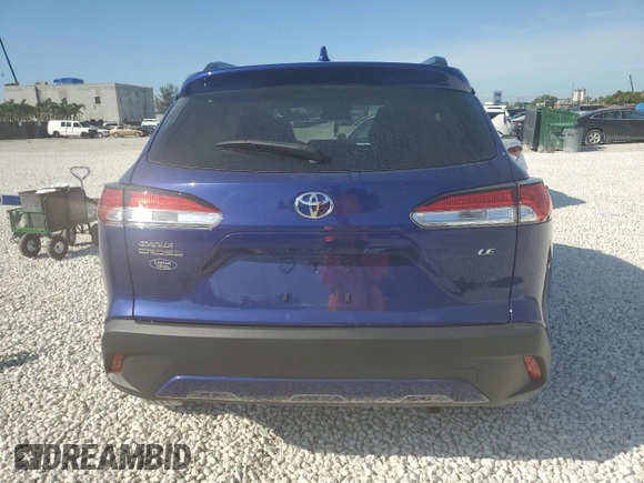 2023 Toyota Corolla Cross LE with VIN 7MUCAAAG0PV063737, listed as a Copart auction lot 86267914 with 13,740 mi miles and Salvage title. Bid and sale history available at DreamBid. Image 6.