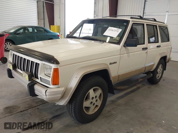 1996 Jeep Cherokee Country with VIN 1J4FT78S5TL232090, listed as a IAAI auction lot 42267272 with 255,417 mi miles and . Bid and sale history available at DreamBid. Image 2.